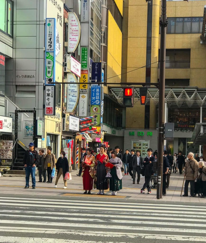 THE BUSTLING NAGANO - TRADITION MIXED WITH MODERN DAY. THE GUY IN THE BACK IS VERY TIRED!
