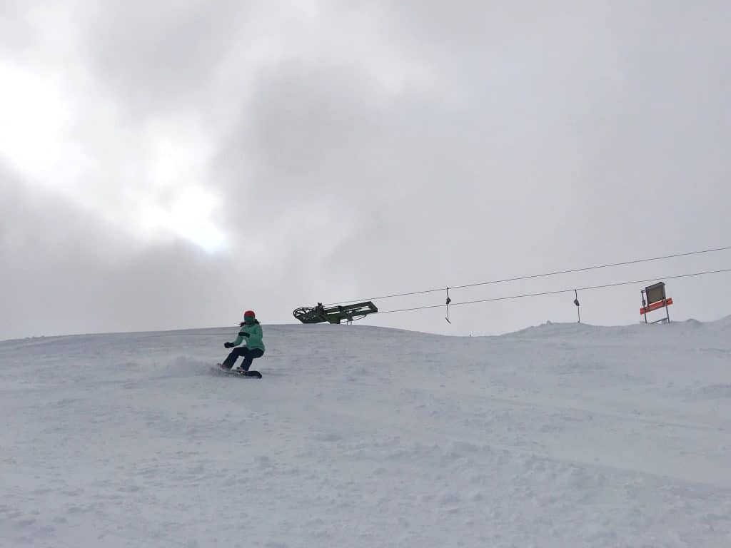 DROPPING IN FROM THE TOP OF THE RIDGE LINE T-BAR - VERY SLIGHTLY OUT-OF-BOUNDS, CUTTING IN QUICKLY TO RIDGE RUN TO AVOID HIKING OUT. BE SURE TO CHECK THE AVALANCHE ADVISORY SIGN FIRST.