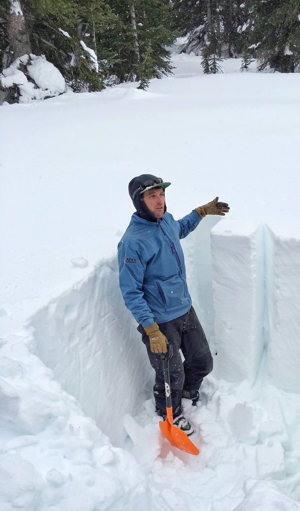 DIGGING OUT A COLUMN IN A SNOW PIT FOR SAMPLING